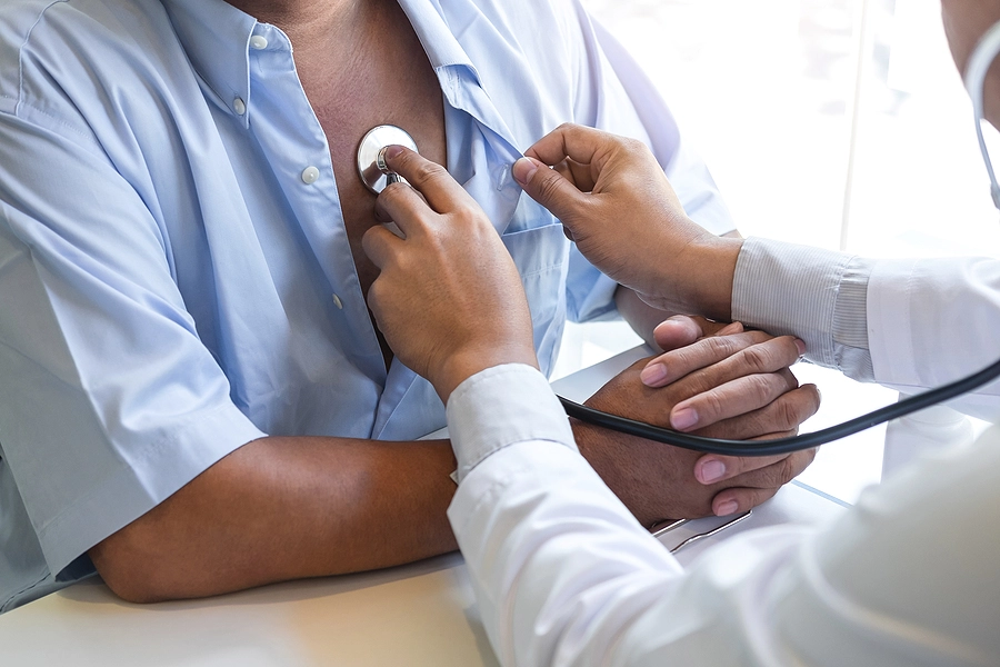 Doctor uses stethoscope to help determine the veterans disability rating for heart disease