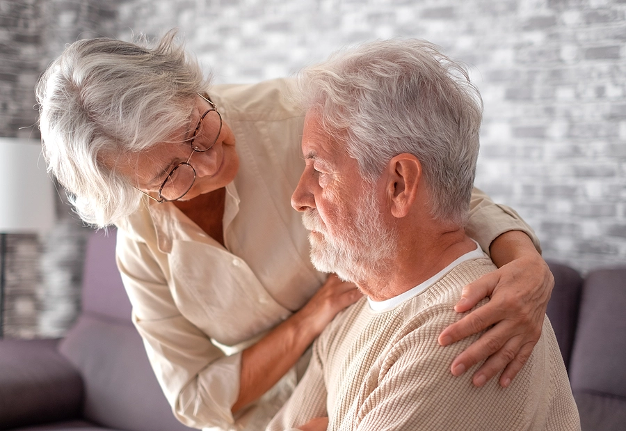 Wife comforting husband with bipolar disorder who just receive a claim denial from the VA