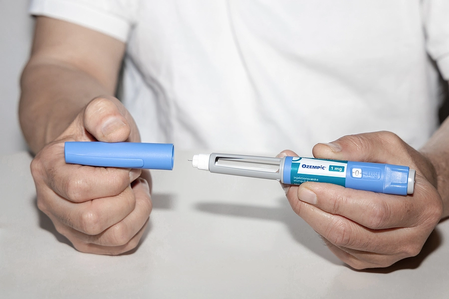 Veteran preparing to take an Ozempic injection to treat their Type II diabetes