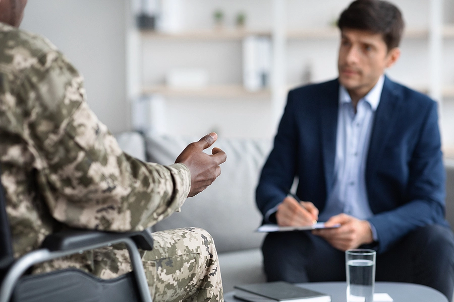 black male veteran in a wheelchair discusses taking his claim to the Board of Veterans' Appeals with his attorney